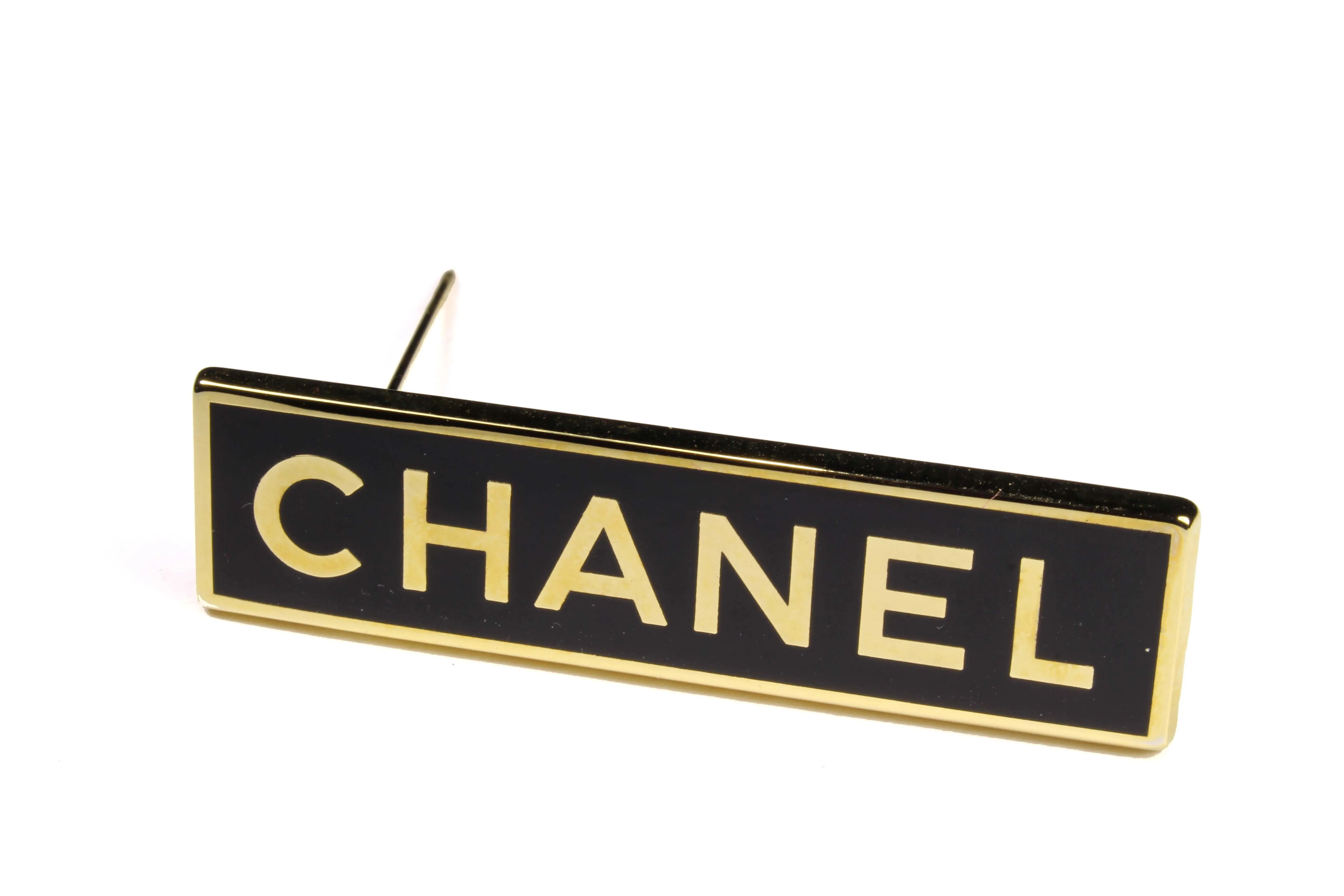CHANEL rectangular logo brooch
